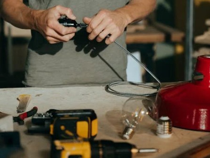 Pinewood Electrical technician performing precise installation work